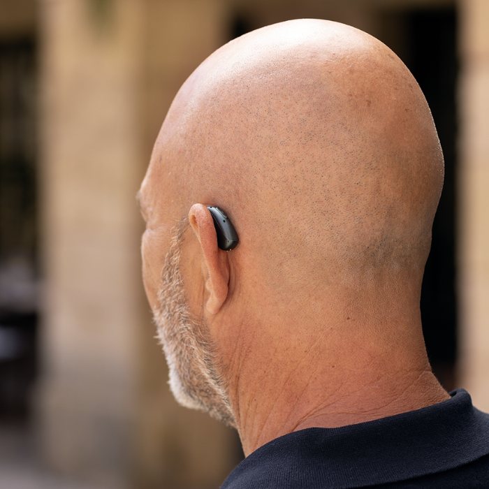 Person wearing Phonak hearing aid